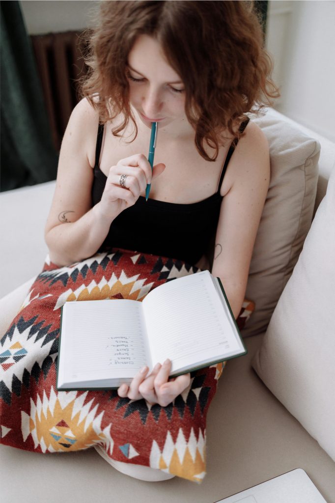 woman making declutter checklist